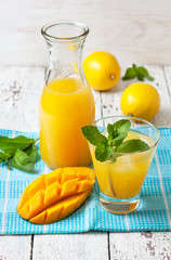 mango ice tea with mint in a glass