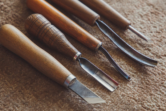 Wood processing. Joinery work. wood carving. wood chisel tool close up. small depth of field. used as backgroun