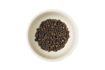 Isolated bowl of black dried pepper on a white background