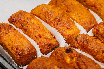 carrot baked cookies on baking tray close up photo