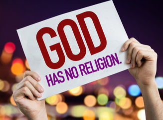 God Has No Religion placard with night lights on background