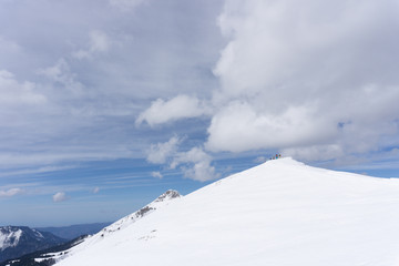 Winter mountain landscape and cloudy sky.