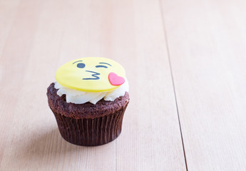Delicious cupcake on table