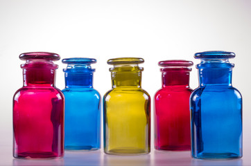 Five colored bottles.