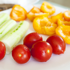 Vegan breakfast. Cucumbers cherry tomatoes and apricots