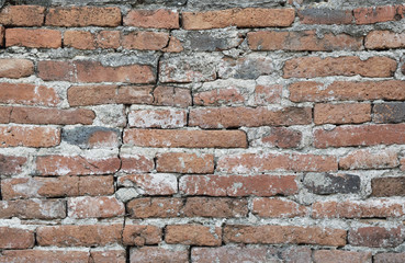 Old damaged brick wall texture for background