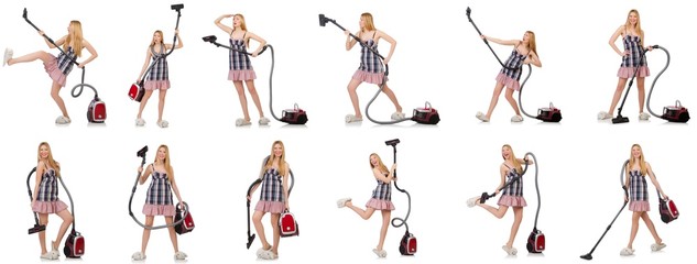 Young woman with vacuum cleaner on white