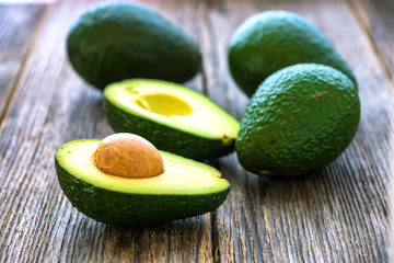 Avocado on wooden background