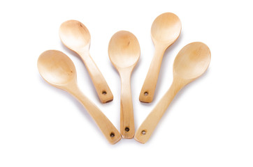 Many wooden spoons isolated on white