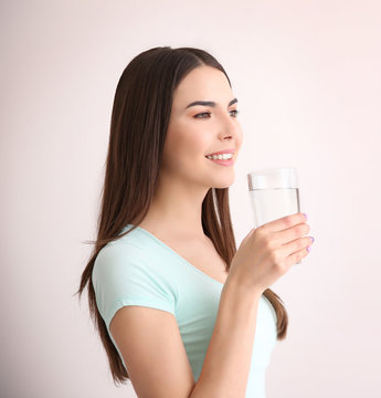 Beautiful girl drinking water