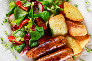 Roasted Sausages with Chips and Mix Vegetable salad