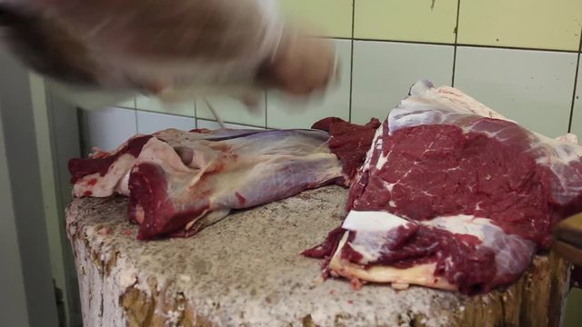 Butcher Cutting with Sharp Knife