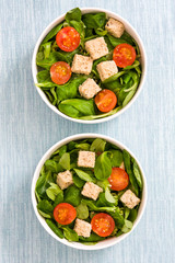 Vegan tofu salad with tomatoes and lamb's lettuce
