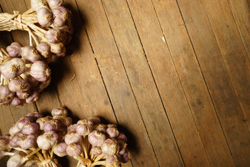 Organic garlic on wood background. , vintage style