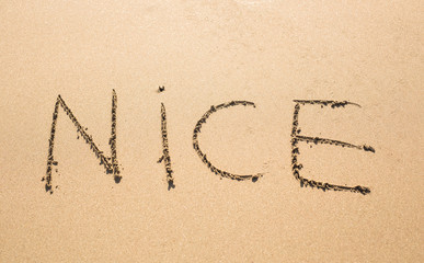 Nice Word Written On Sunny Summer Beach Sand