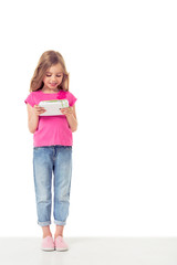 Cute little girl with gadget