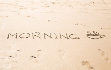 Abstract hand writing on the sand word Morning