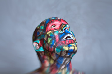 Obraz na płótnie Canvas Surprised Superhero portrait, colorful face art with tilt shift and motion blur effect.