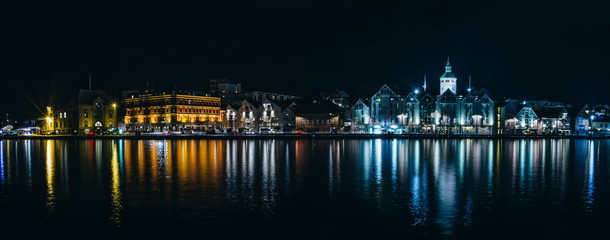 Beautiful night Stavanger cityscape with lights water reflection, Norway