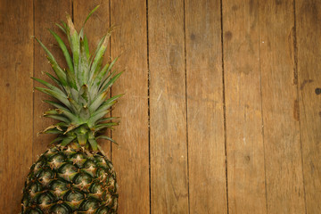 pineapple on the wood texture background