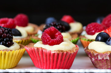 close up of mini pastry with custard cream and red fruits