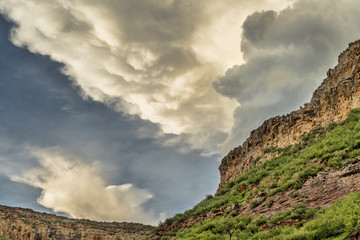 Fototapeta na wymiar Dramatic clouds over sandstone cliffs near Fort Collins, Colorado