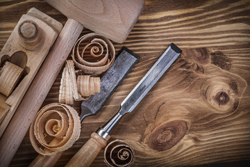 Wooden mallet shaving plane flat chisels curled shavings on vint
