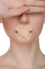 face of european woman with medical patch