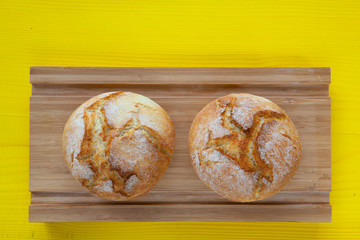 Breakfast - Two wheat bread on wooden table