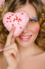 beautiful woman with donut in face