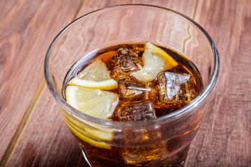 The cooling drink with ice and lemon