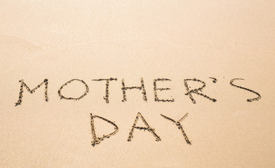 Mother's day background on the sandy beach