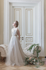 Obraz premium beautiful young girl bride in a beautiful airy dress in beige colors , wedding in the style of boho