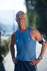 Fototapeta premium portrait of handsome senior jogging man