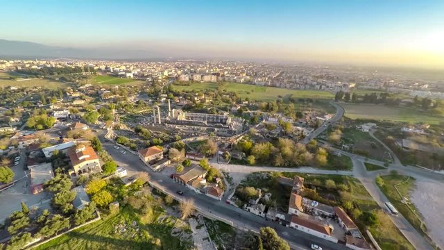 Tourist spot around the Apollo Temple, aerial, 4k. Tilt view of the Holy Road and Didim town far away.
