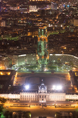 Fototapeta premium Aerial Night view of Paris City and Seine river shot on the top of Eiffel Tower