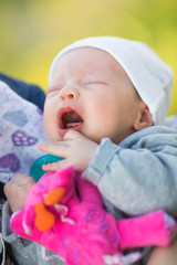 Newborn baby crying, suffering from baby colic pain