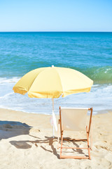 Female hat, chair and umbrella on stunning tropical beach background vacation 