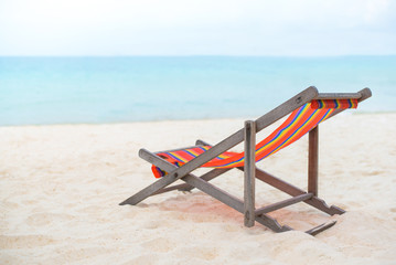 beach chair on the sand beach with sea and blue sky