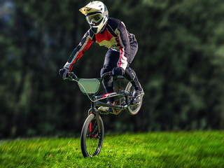Man riding bmx bike performing a trick