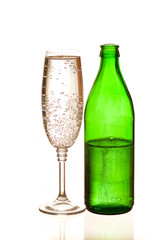 Mineral water in a bottle and a glass