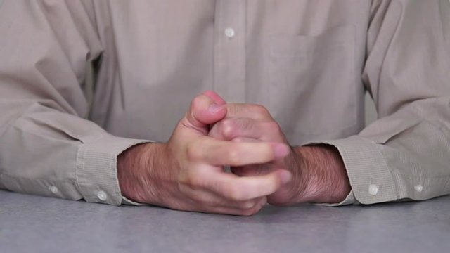 Male hands expressing fear and anxiety.
