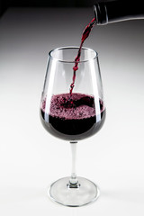 Pouring Red Wine Into Glass
