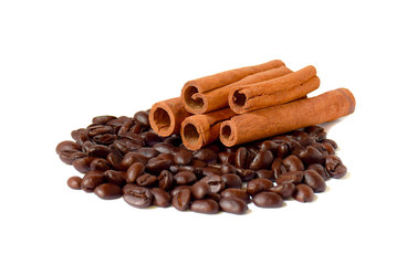 Several sticks of cinnamon and coffee beans.