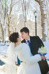 bride and groom in winter park