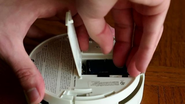 Chaging The Batteries Of A Smoke Detector