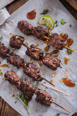 grilled beef kebabs with sauce and spices