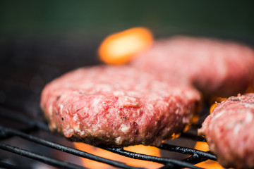 Raw beef on bbq grill