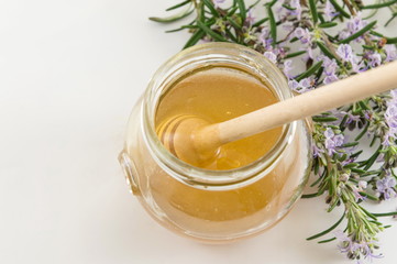 Fresh flowers and a jar of honey