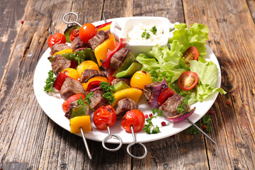grilled beef skewer and salad